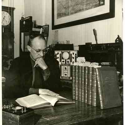 JHHJr in lab office w patent books