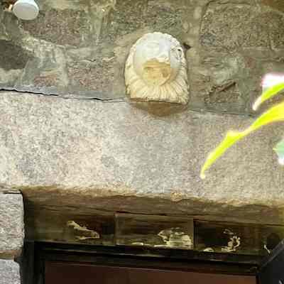 Lion Head Carving (above exterior side of courtyard door)