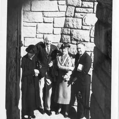 JHHJr with man & 2 ladies on oceanside stairs