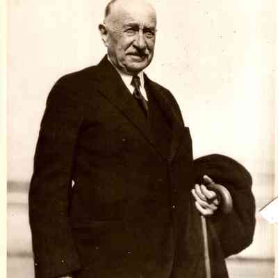 JHHSr holding cane and coat