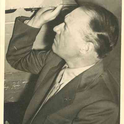 1940-1955 Hammond looking at unknown machine
