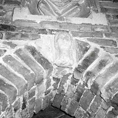 Stone Woman's Head (within doorway arch)