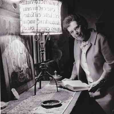 Corinne Witham in Sun Room with various artifacts