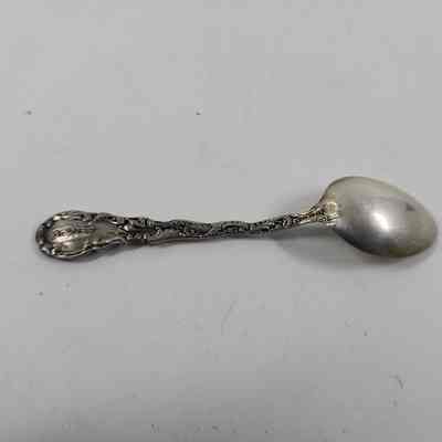 Back of silver demitasse spoon