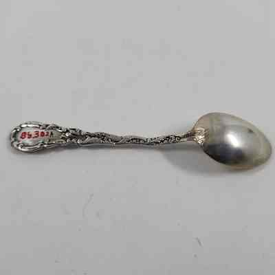 Back of silver demitasse spoon