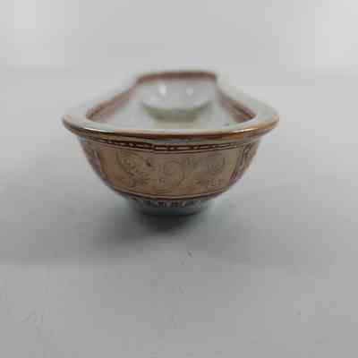 Side of soap dish with vine design painted