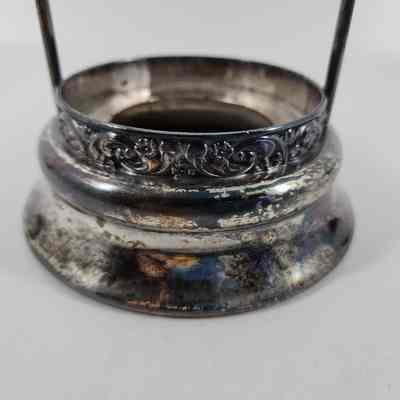 Floral engraving around base of stand