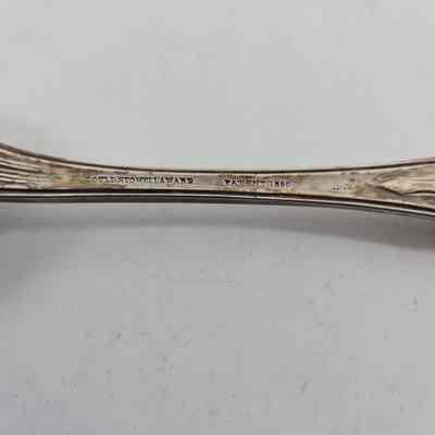 Engraving "GOULD, STOWELL & WARD PATENT 1850 11-12" on back of spoon handle