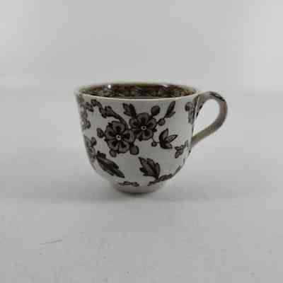 White teacup with brown floral design