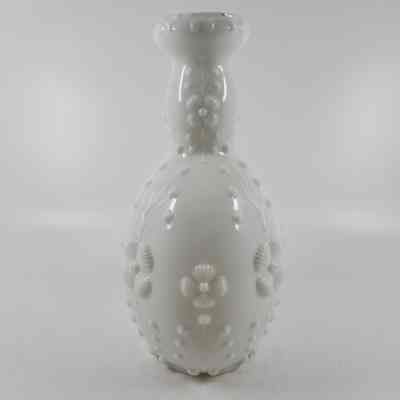 Side of white milk glass bottle