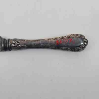 Back of handle showing discoloration and accession number - 86.107j