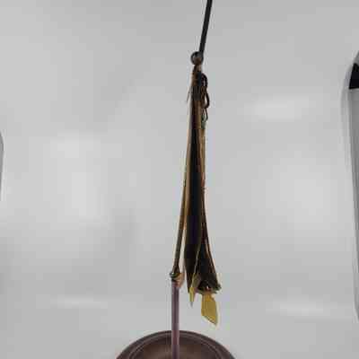 Top of candle screen loose in base, leans forward