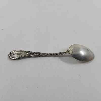 Back of silver demitasse spoon