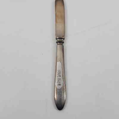 Back of fruit knife with accession number