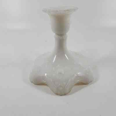 Front of white milk glass candlestick