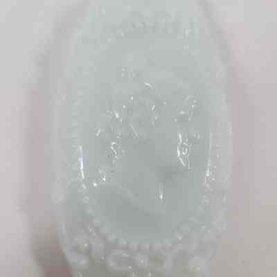 Woman's profile embossed on lid