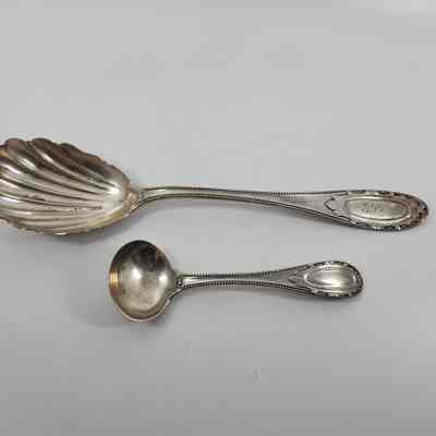 Set of matching silver, one serving spoon and one ladle