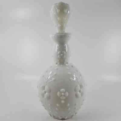 White milk glass stopper with floral pattern with matching bottle (2015.007. A)