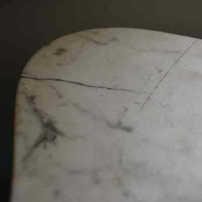 Cracked marble on upper left corner: Origformat: Artifact