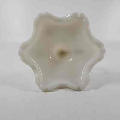 Bottom of white milk glass candlestick