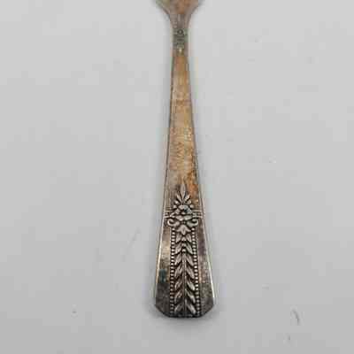 Floral design on handle of butter spreader