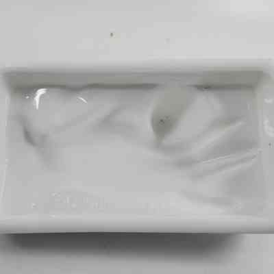 Bottom of white milk glass lid