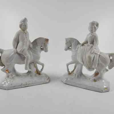 Pair of white ceramic figurines of a man and woman on horseback (2015.002 A and B)