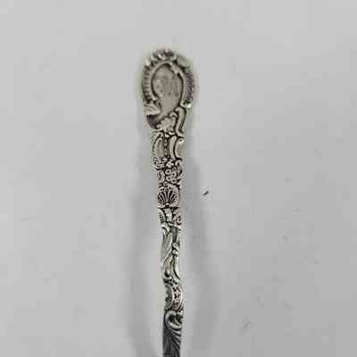 Handle with floral pattern and monogrammed "M"
