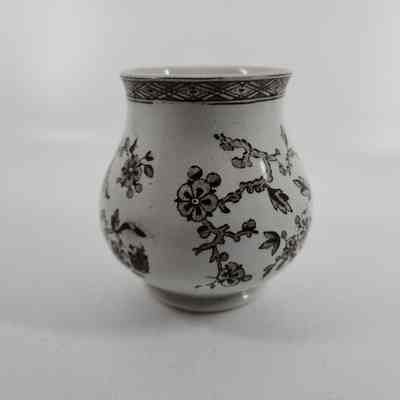 White sugar bowl with brown floral design