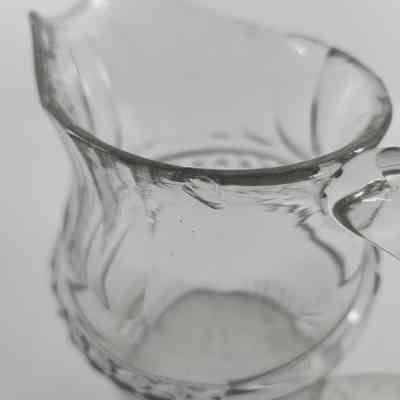 Chip in rim of glass pitcher