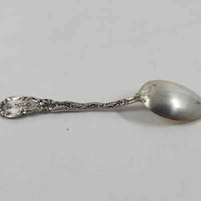 Back of silver demitasse spoon