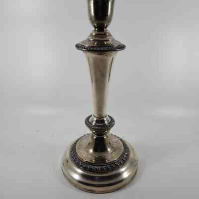 Base of candelabrum disconnected, becoming a single candlestick