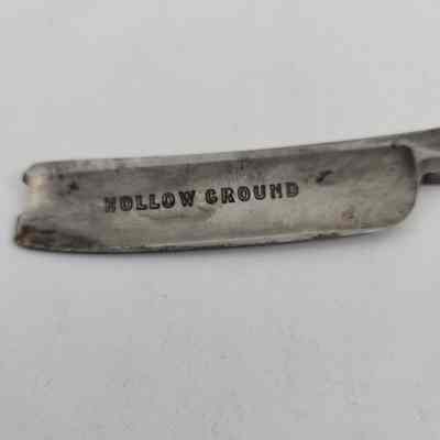 "HOLLOW GROUND" engraved on blade