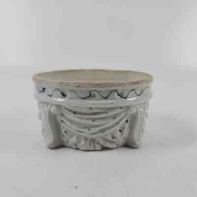 Back of vase with green markings