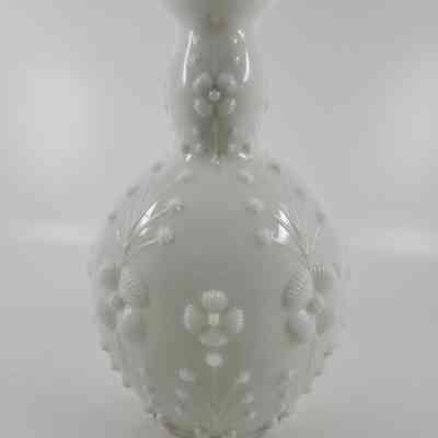 Bottle with embossed floral sprays