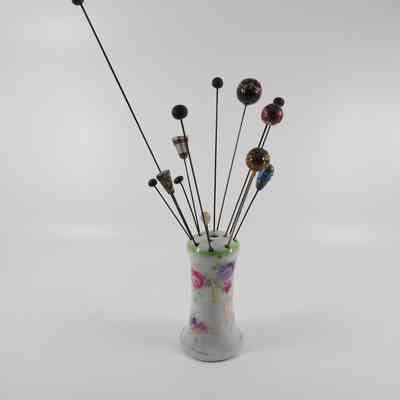 Hatpin holder with assorted hatpins (1986.557 A-M)
