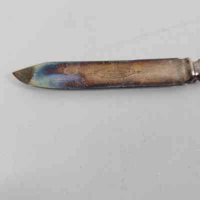 Engraving "1847 Rogers Bros Warranted" and discoloration of the blade