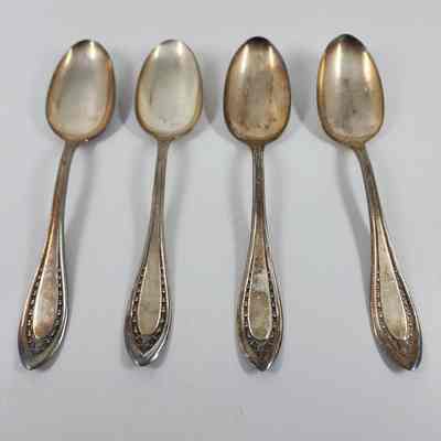 Set of four dessert spoons