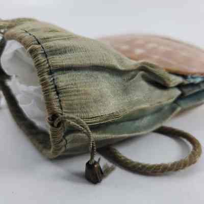 Seam of drawstring purse