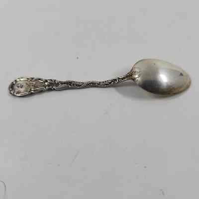 Back of silver demitasse spoon