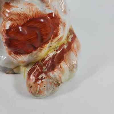 Repair of crack around tail of Spaniel figurine