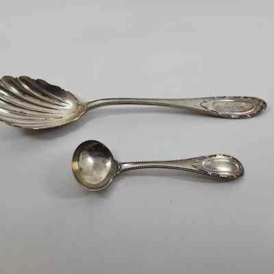 Set of two matching silver pieces, one a serving spoon and one a ladle