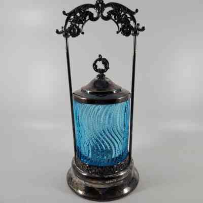 Lid paired with blue glass tumbler (2015.008 A) and silver stand (2015.008 B)