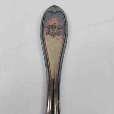 Engraving "KLJ" on handle of knife
