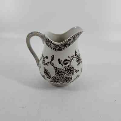 Reverse side of pitcher with brown floral design