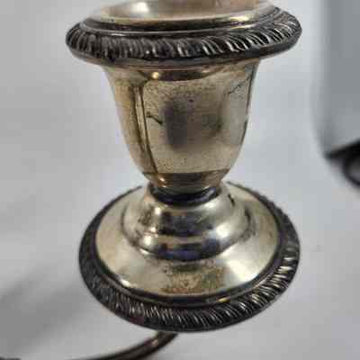 Engraving around cup of the candelabrum