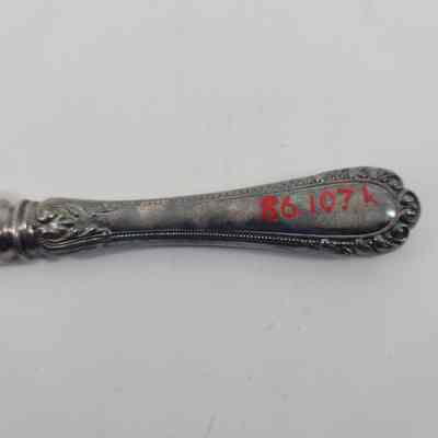 Back of handle showing discoloration and accession number - 89.107k