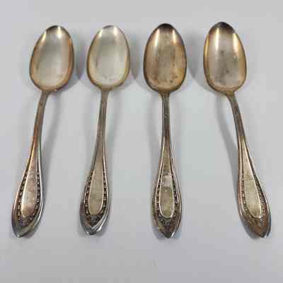 Set of four dessert spoons