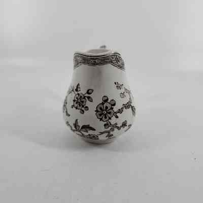 Front of pitcher with brown floral design