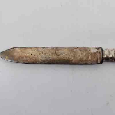 Engraving of "Holmes & Edwards" and discoloration of the blade